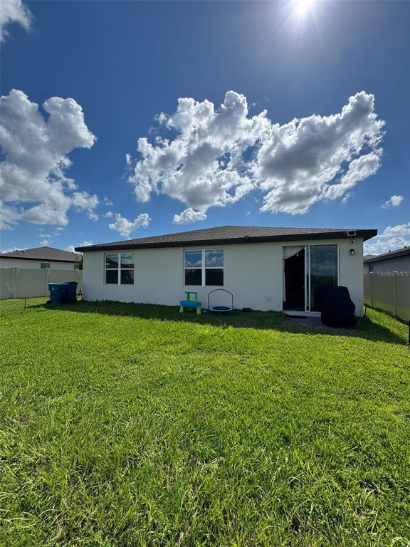 4836 Rigging Street Haines City, FL 33844 - Photo 29 of 29 a front view of a house with garden