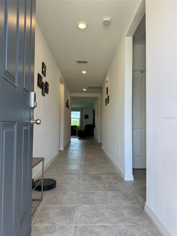 4836 Rigging Street Haines City, FL 33844 - Photo 5 of 29 a view of a hallway with seating area