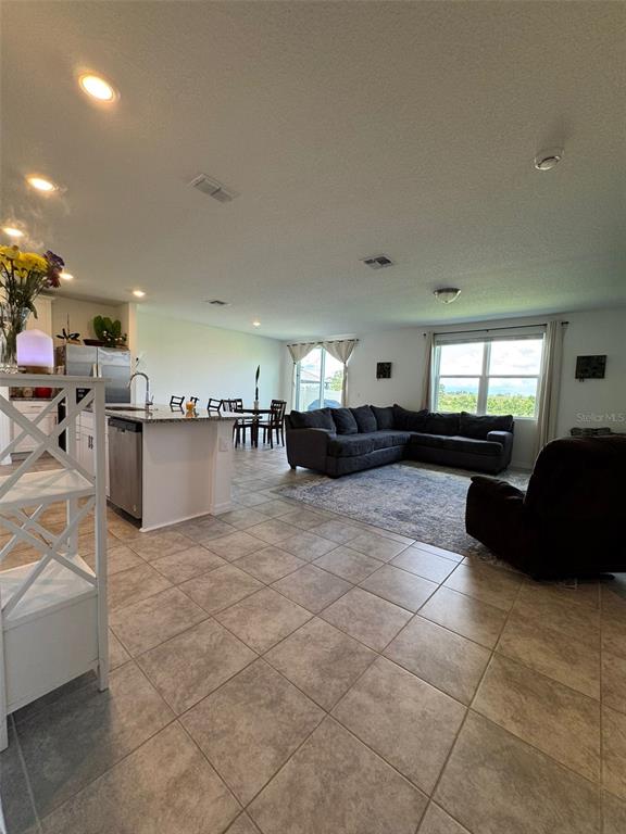 4836 Rigging Street Haines City, FL 33844 - Photo 8 of 29 a living room with furniture and a couch