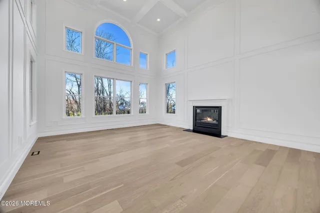 a large kitchen with kitchen island a large counter space a sink stainless steel appliances and cabinets