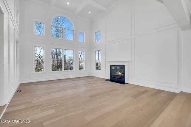a kitchen with granite countertop white cabinets and sink