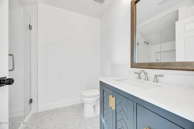 an empty room with painting on the wall