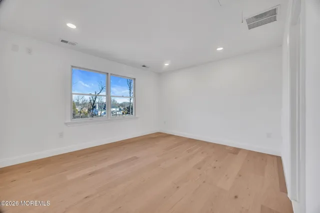a bathroom with a mirror and a sink