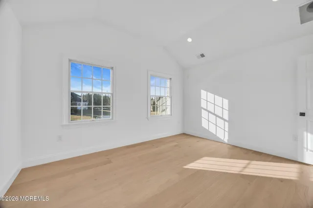 a view of a balcony with wooden floor