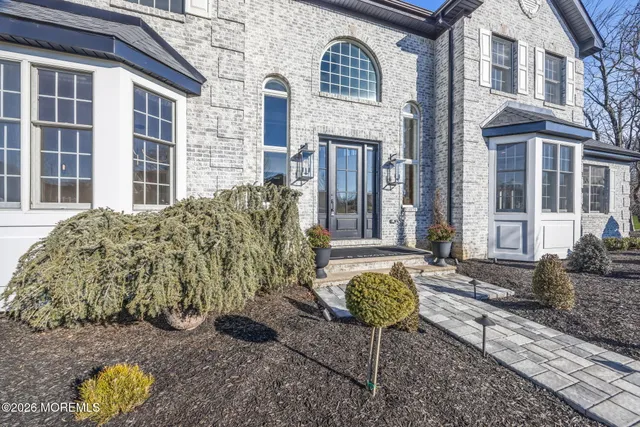 a view of a chairs and table in a backyard