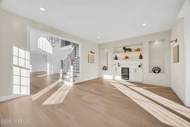 a view of an empty room with a fireplace