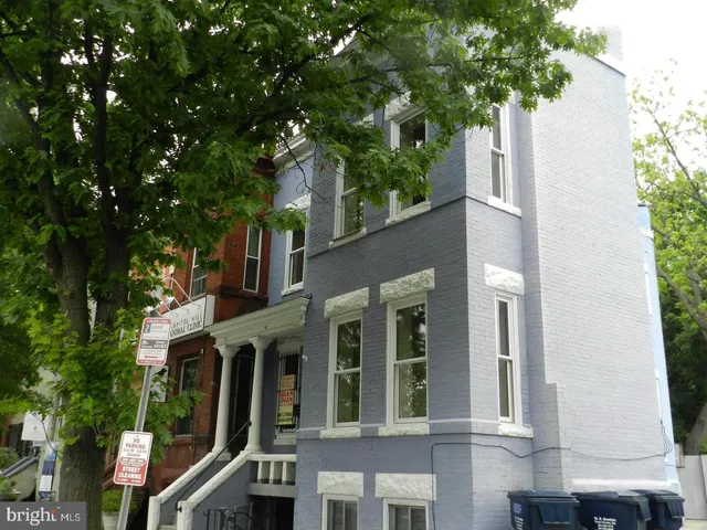 a view of a building with a tree