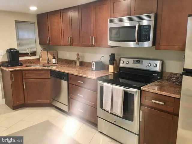 a kitchen with a stove and a microwave