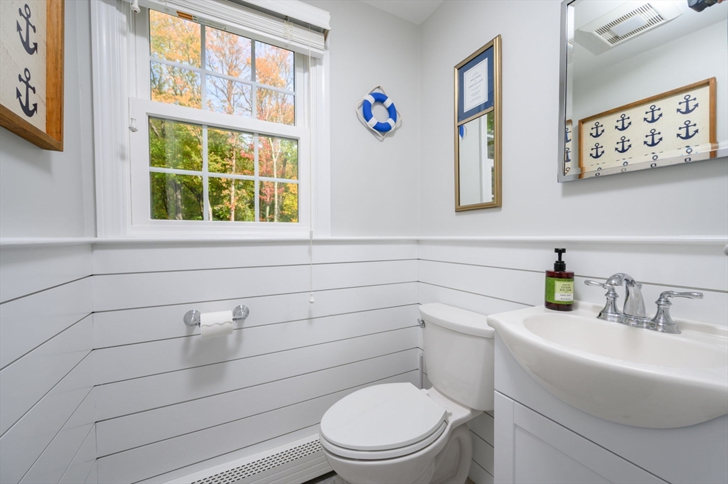 99 Doane Street Cohasset, MA 02025 - Photo 17 of 36 a bathroom with a toilet sink and window