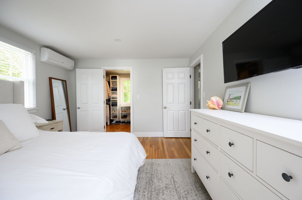 99 Doane Street Cohasset, MA 02025 - Photo 20 of 36 a bedroom with a bed and a flat screen tv