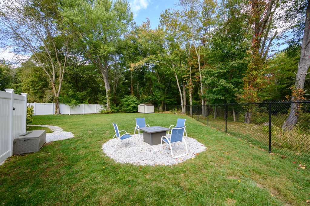 99 Doane Street Cohasset, MA 02025 - Photo 28 of 36 a view of a garden with a fountain