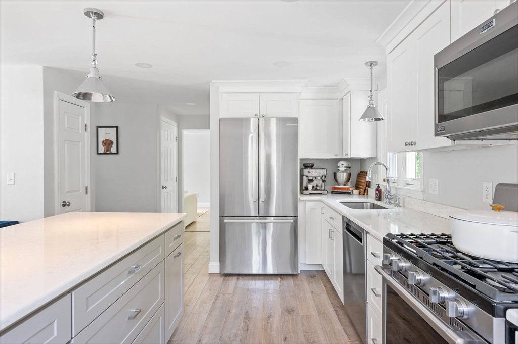 99 Doane Street Cohasset, MA 02025 - Photo 6 of 36 a kitchen with stainless steel appliances granite countertop a refrigerator a stove and a sink