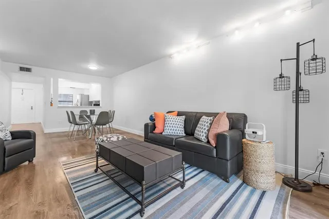 a living room with furniture and a table