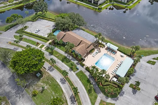 an aerial view of a house a garden and swimming pool