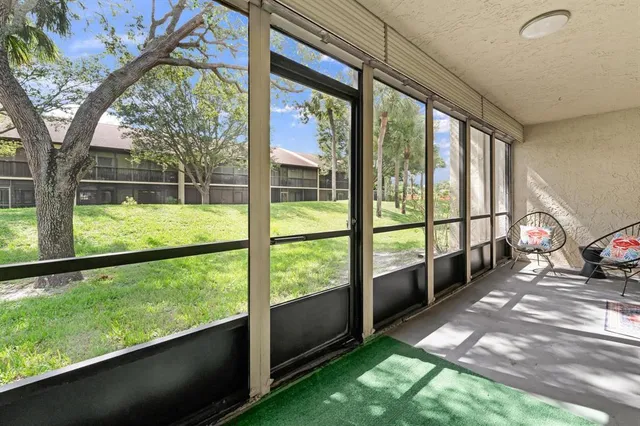 a view of a porch with a big yard