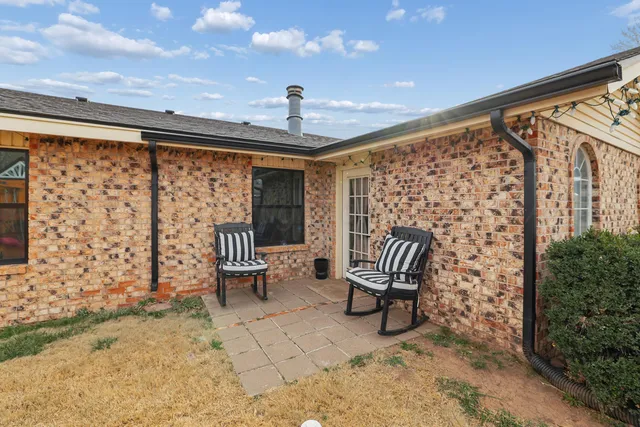 a view of living room with furniture and a rug