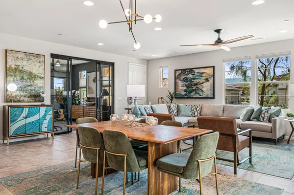a view of a dining room with furniture window and outside view