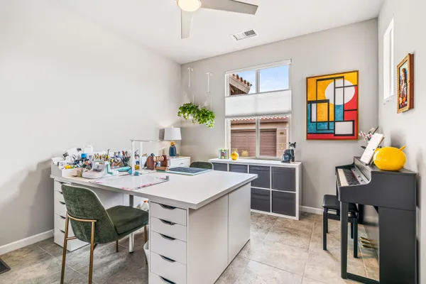 a room with a table and chairs in it