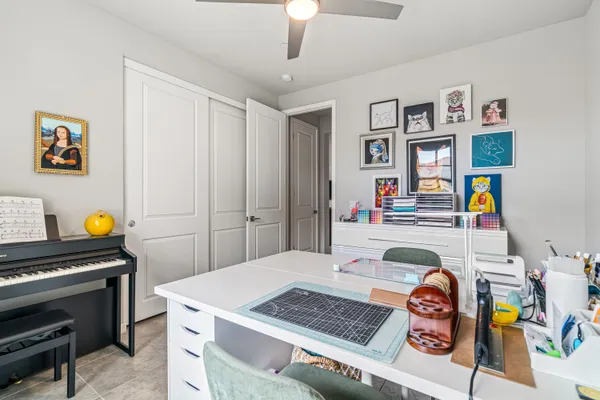 a bedroom with a bed and a tv