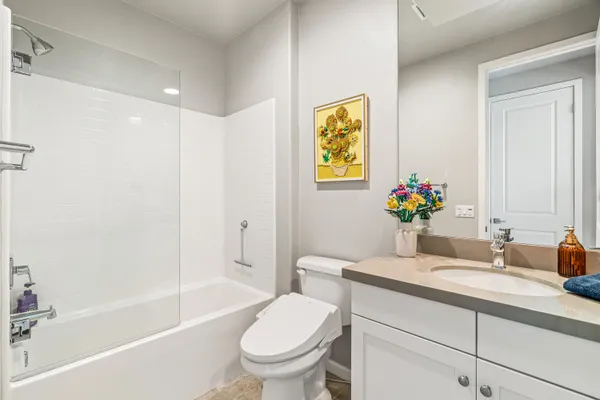 a bathroom with a sink toilet and bathtub