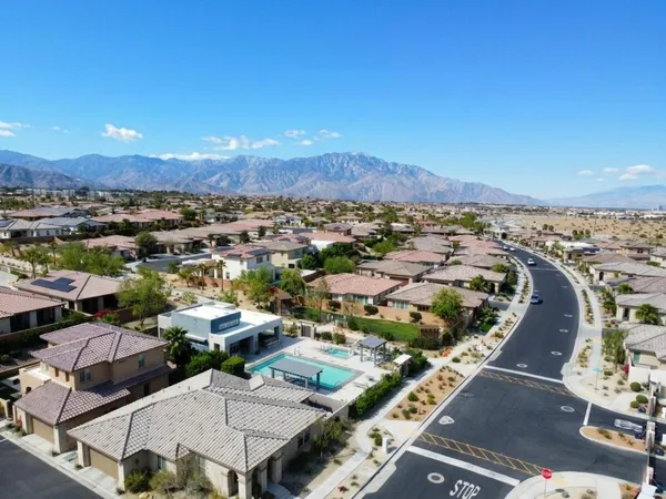 an aerial view of residential houses with outdoor space