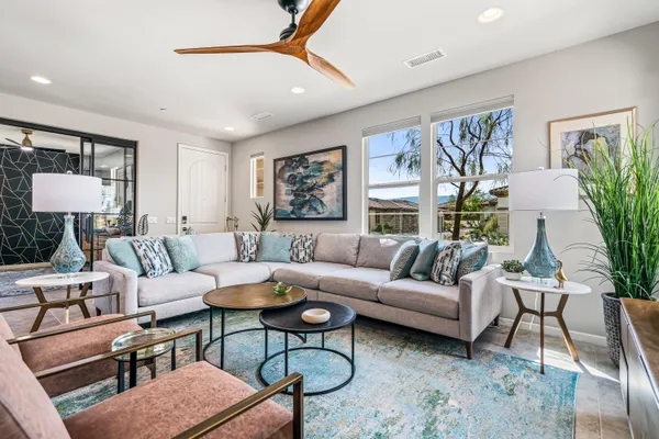 a living room with furniture and a large window