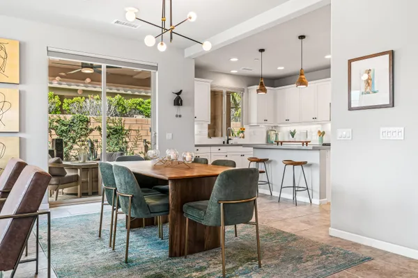 a view of a dining room with furniture window and outside view