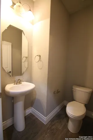 a large kitchen with stainless steel appliances a large counter top