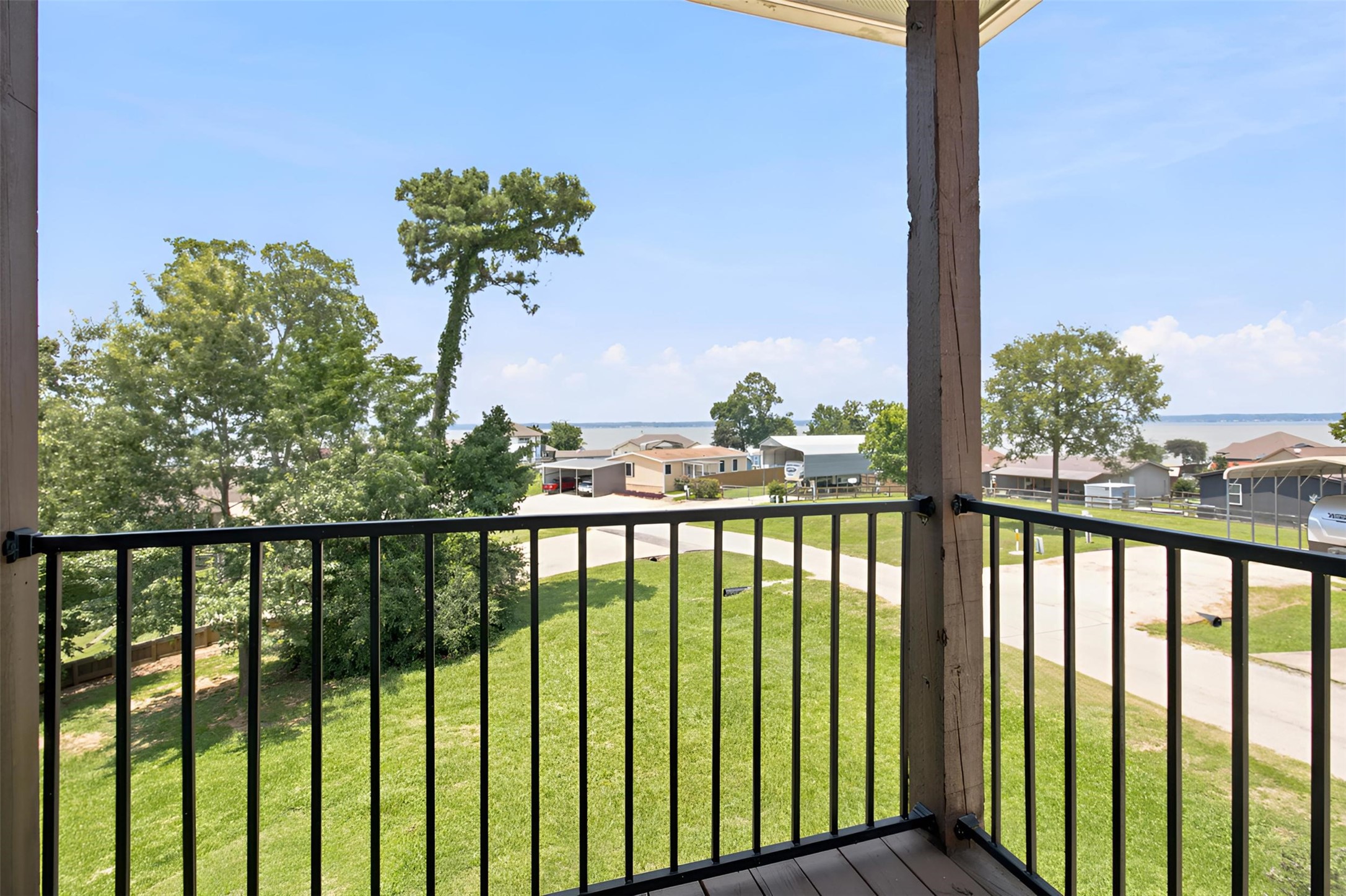 201 Coco Loop Point Blank, TX 77364 - Photo 5 of 41 Beautiful Lake Views from every spot on the decks of this amazing home