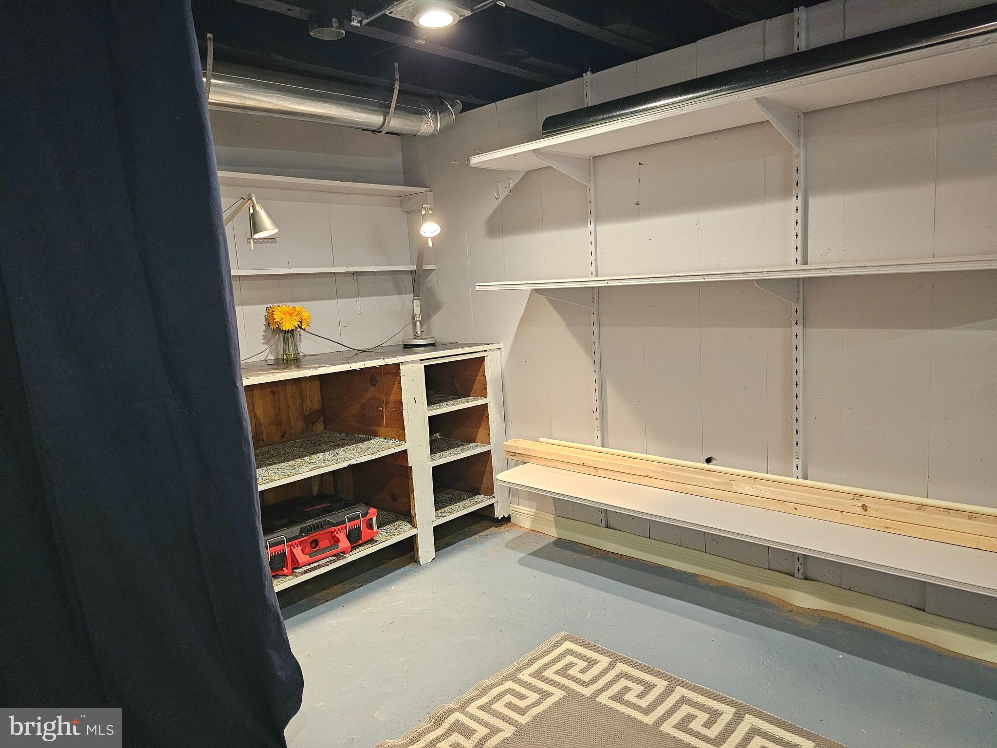 2519 Webb Street Philadelphia, PA 19125 - Photo 17 of 19 Other side of basement w/ work space and shelving