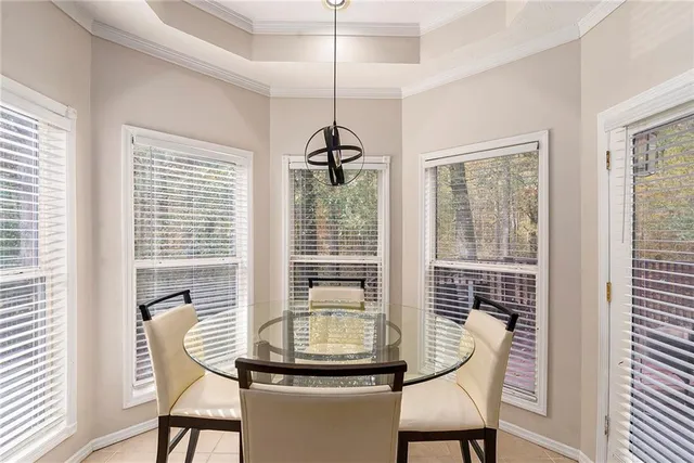 a dining room with furniture and window