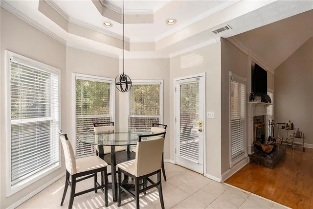 a view of a dining room with furniture window and outside view