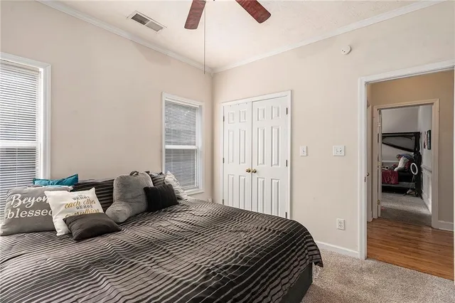 a bedroom with a bed and walk in closet