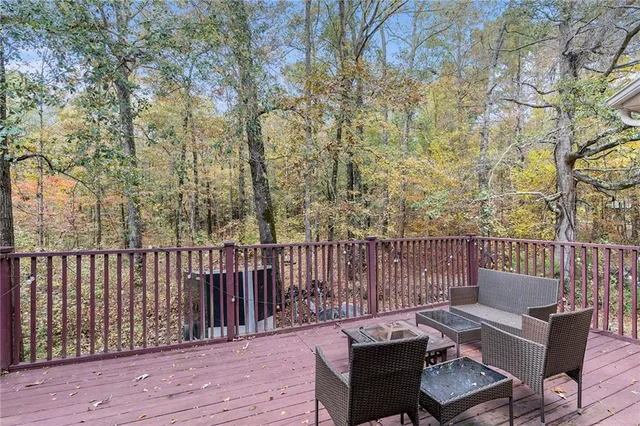 a view of a chair and table on the deck
