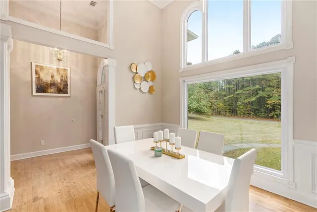 a dining room with furniture and window
