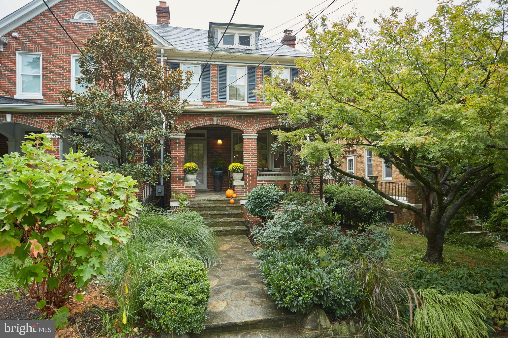 front view of a house with a small yard