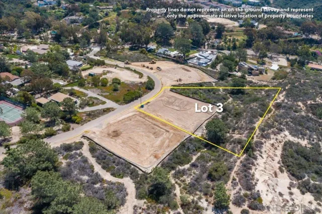 an aerial view of a golf course with parking space