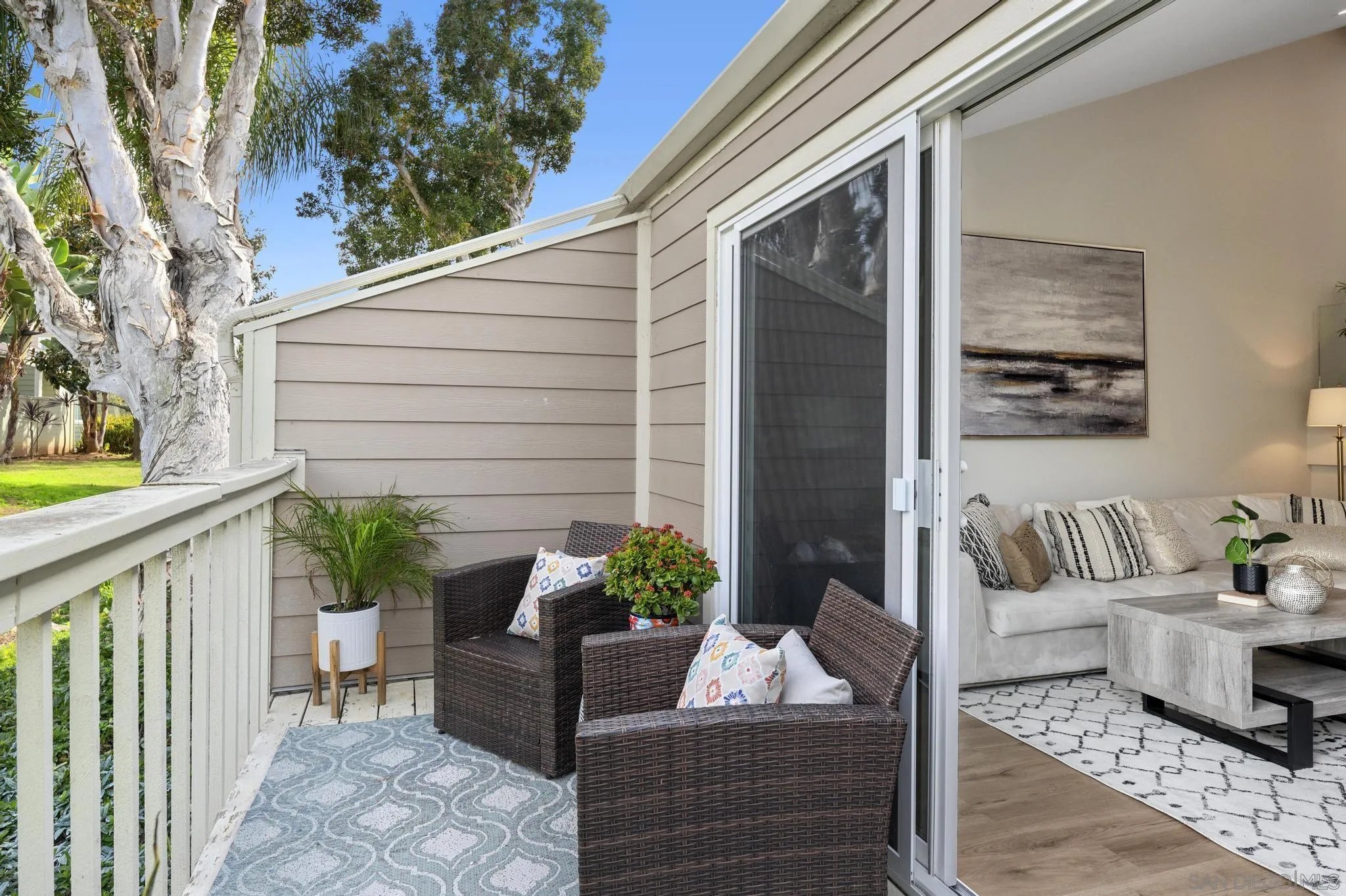 1735 Aldersgate Road Encinitas, CA 92024 - Photo 14 of 49 a view of a porch with furniture and a potted plant