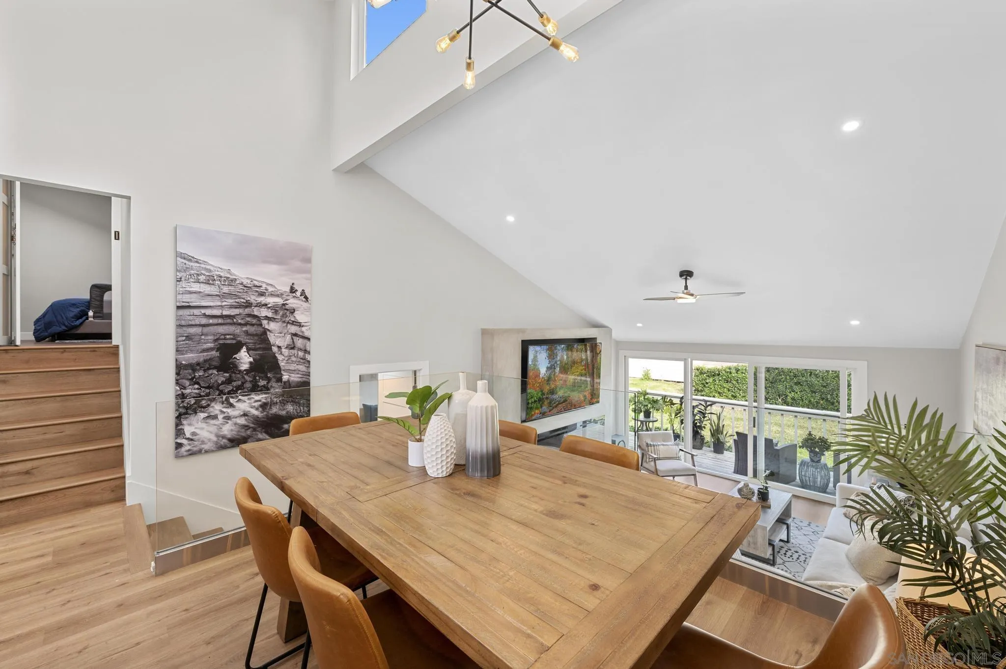 1735 Aldersgate Road Encinitas, CA 92024 - Photo 15 of 49 a view of a dining room with furniture window and wooden floor