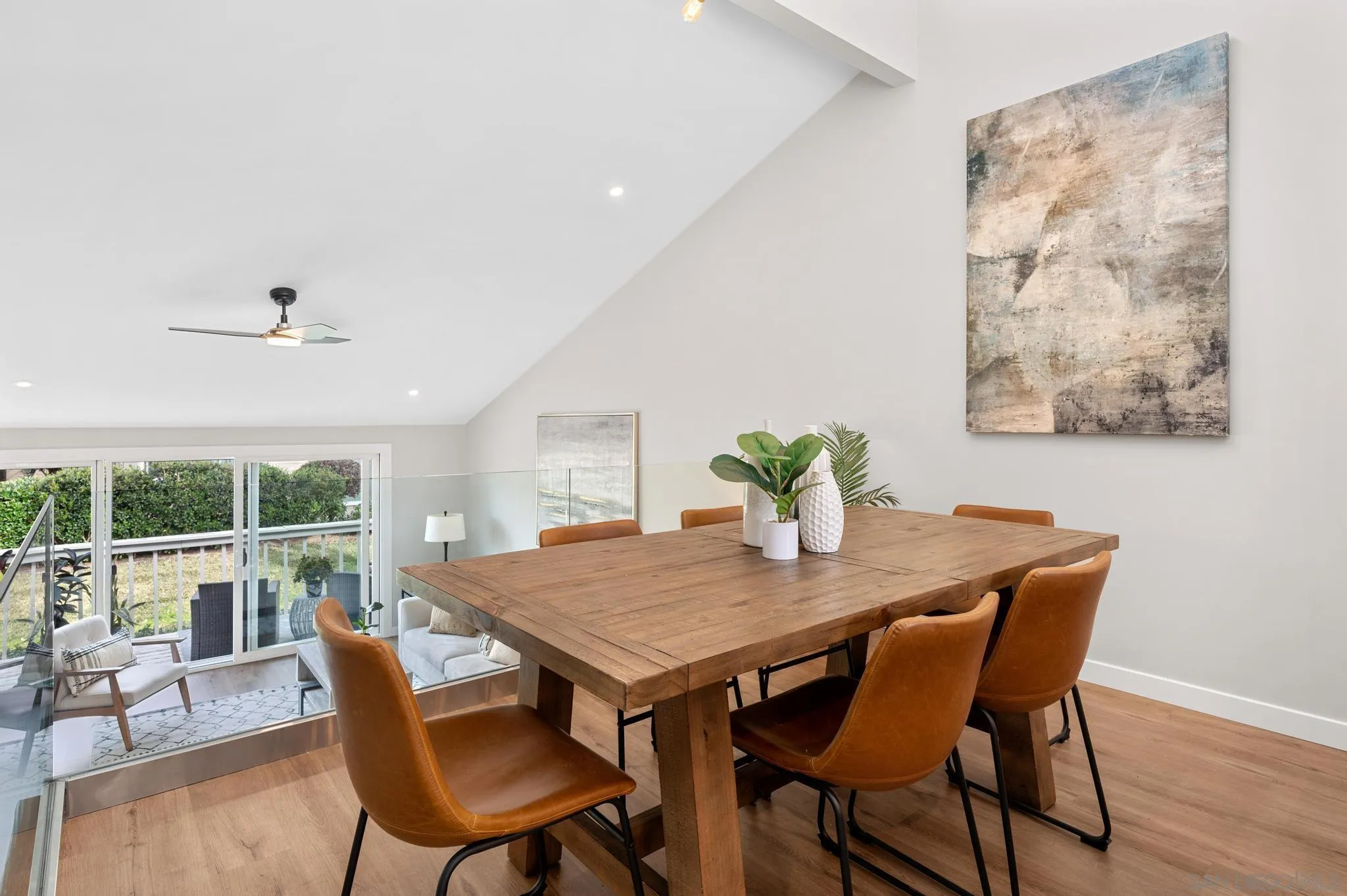 1735 Aldersgate Road Encinitas, CA 92024 - Photo 16 of 49 a view of a dining room with furniture window and wooden floor