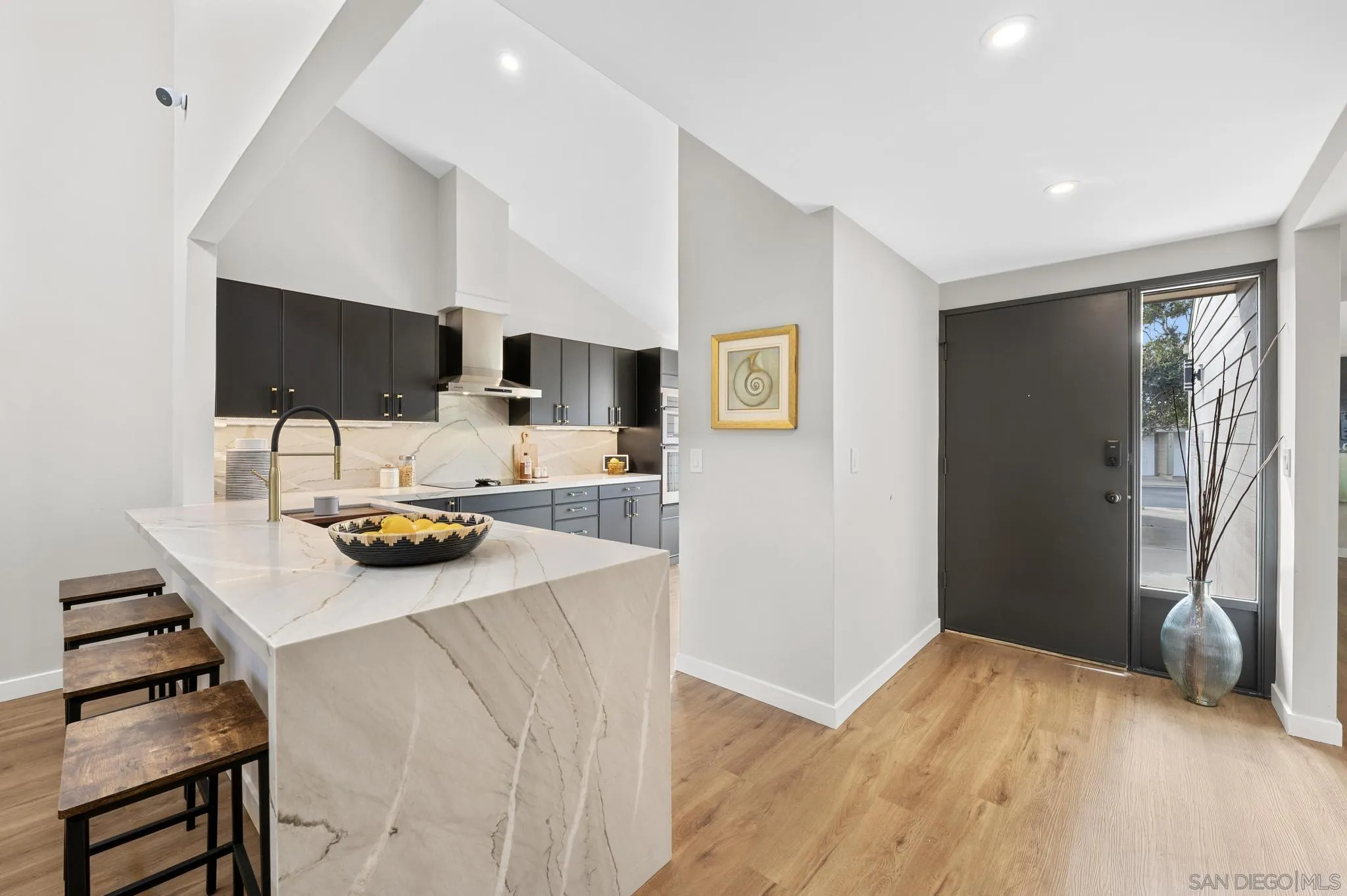 1735 Aldersgate Road Encinitas, CA 92024 - Photo 17 of 49 a kitchen with a sink a stove and a refrigerator