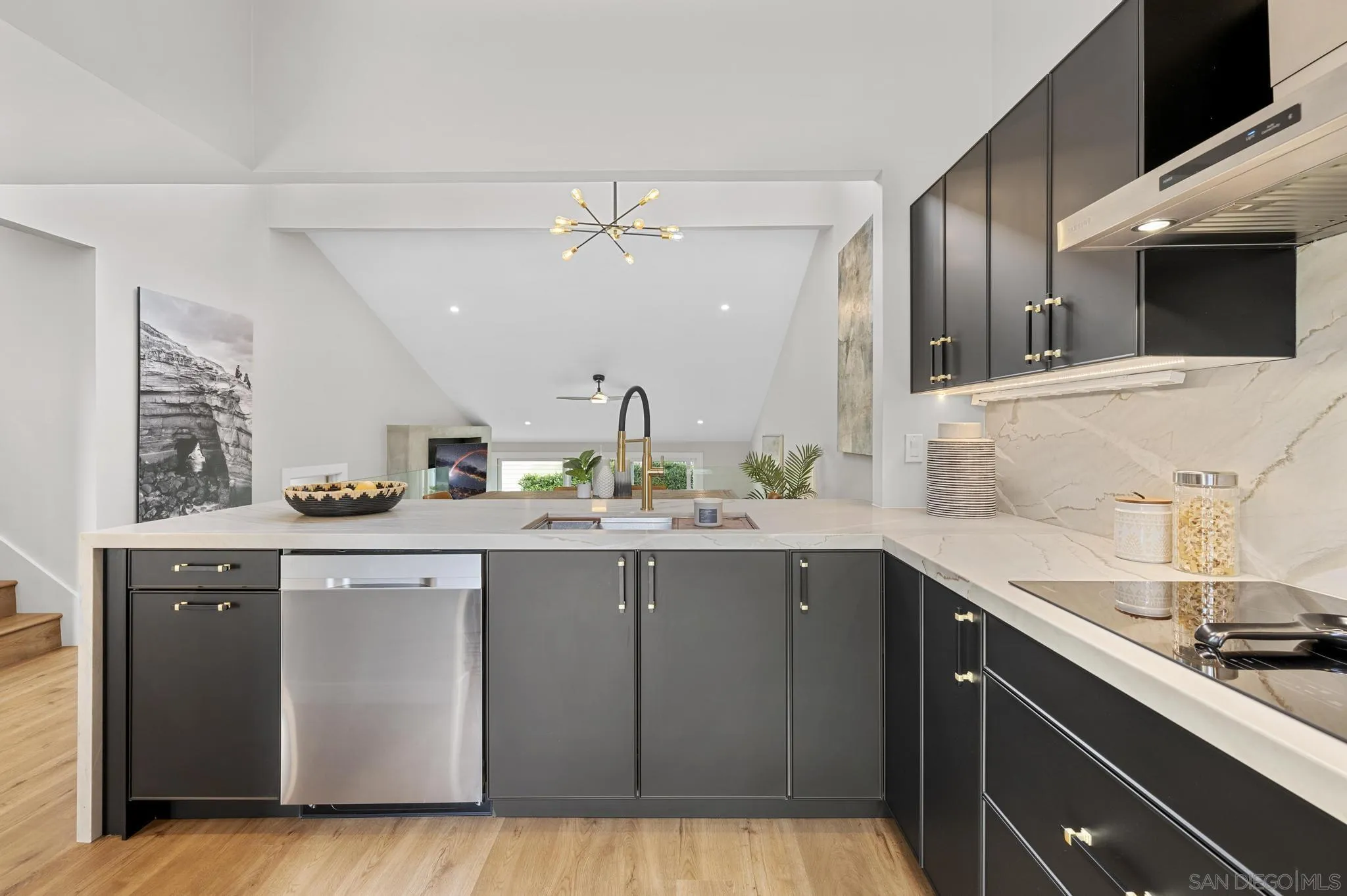 1735 Aldersgate Road Encinitas, CA 92024 - Photo 19 of 49 a kitchen with a sink and cabinets