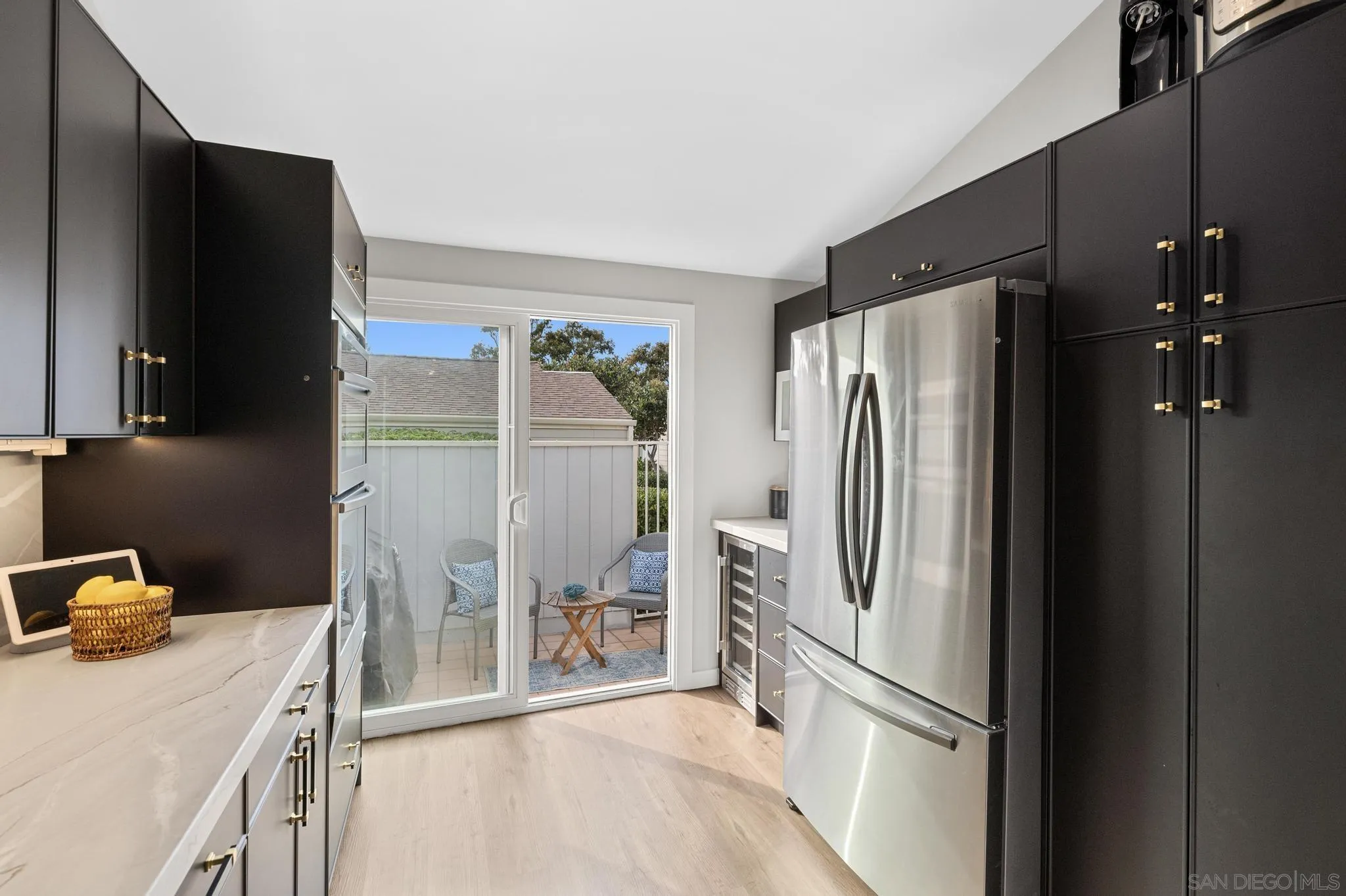 1735 Aldersgate Road Encinitas, CA 92024 - Photo 22 of 49 a kitchen with stainless steel appliances a refrigerator and a sink
