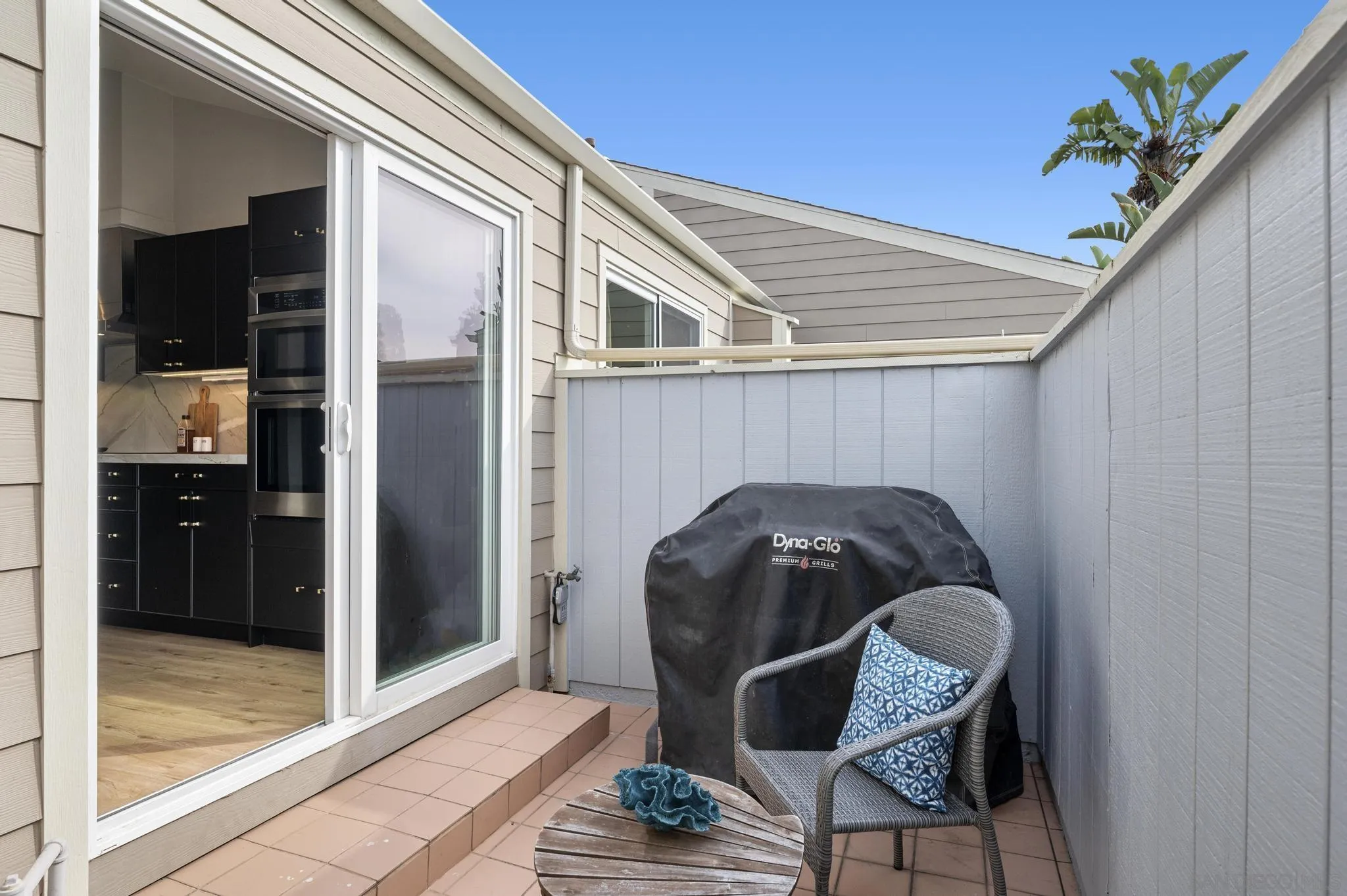 1735 Aldersgate Road Encinitas, CA 92024 - Photo 23 of 49 a backyard of a house with table and chairs