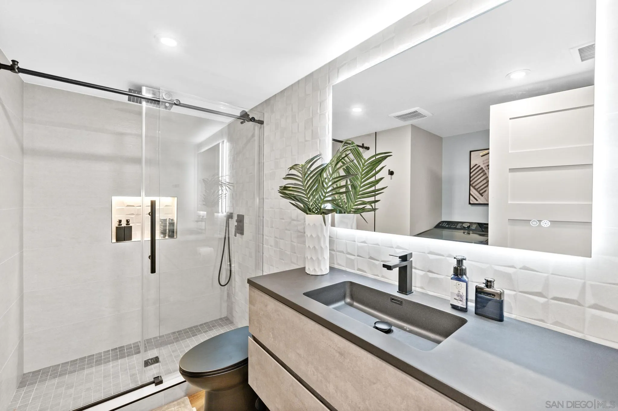 1735 Aldersgate Road Encinitas, CA 92024 - Photo 25 of 49 a bathroom with a granite countertop sink a toilet and shower