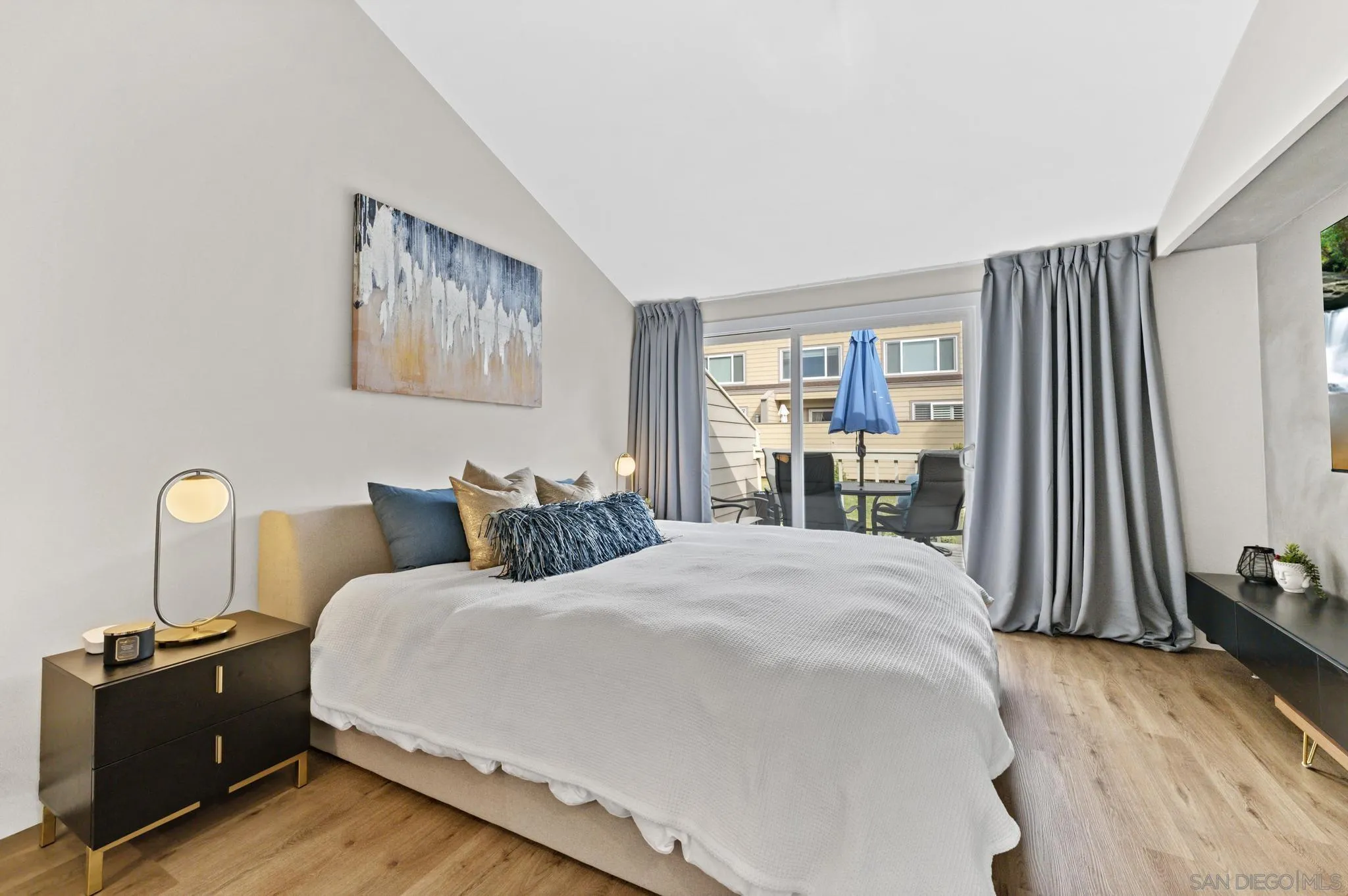 1735 Aldersgate Road Encinitas, CA 92024 - Photo 35 of 49 a bedroom with a bed and a dresser next to a window