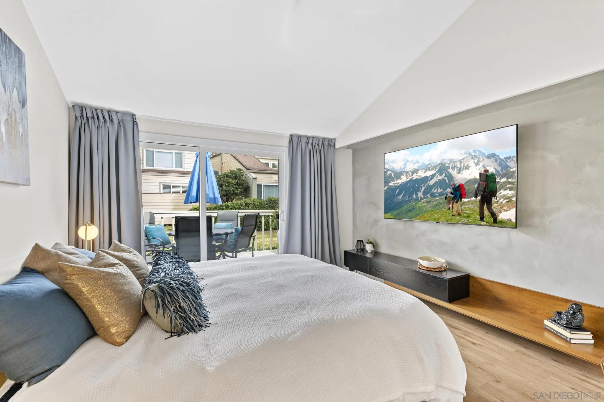 1735 Aldersgate Road Encinitas, CA 92024 - Photo 37 of 49 a bedroom with a bed and glass wall