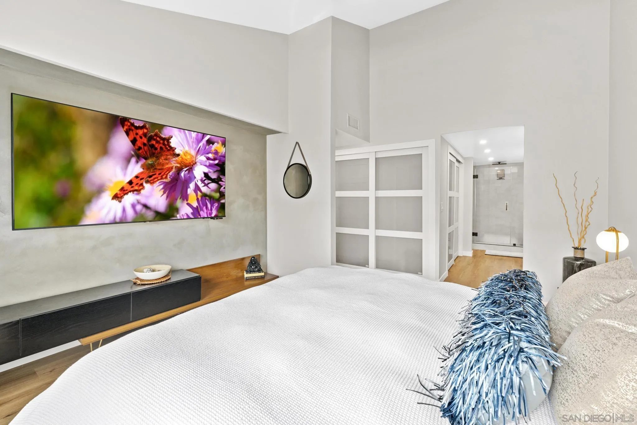 1735 Aldersgate Road Encinitas, CA 92024 - Photo 39 of 49 a bedroom with a bed and a wall painting