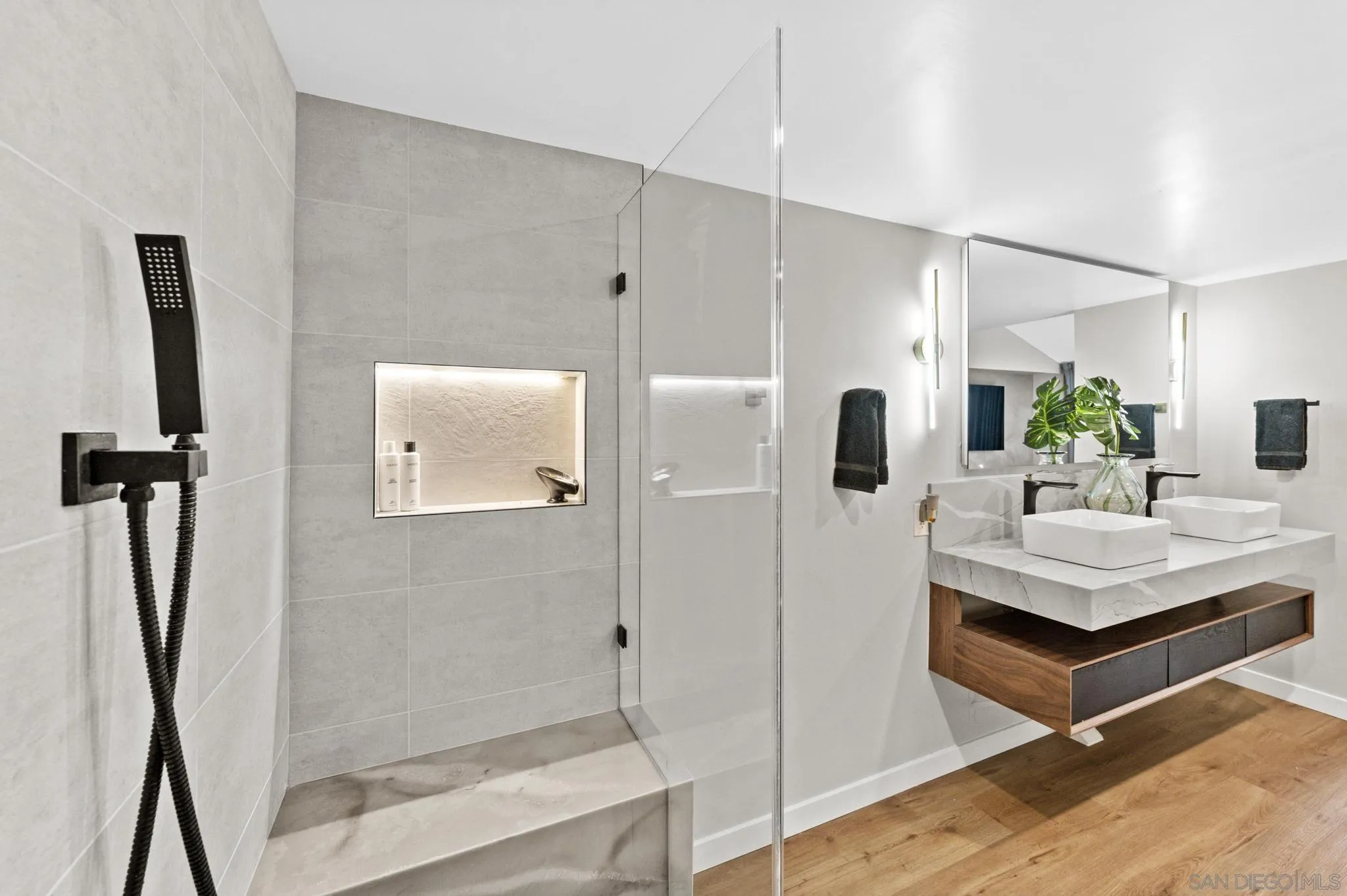 1735 Aldersgate Road Encinitas, CA 92024 - Photo 41 of 49 a bathroom with a sink a mirror and shower