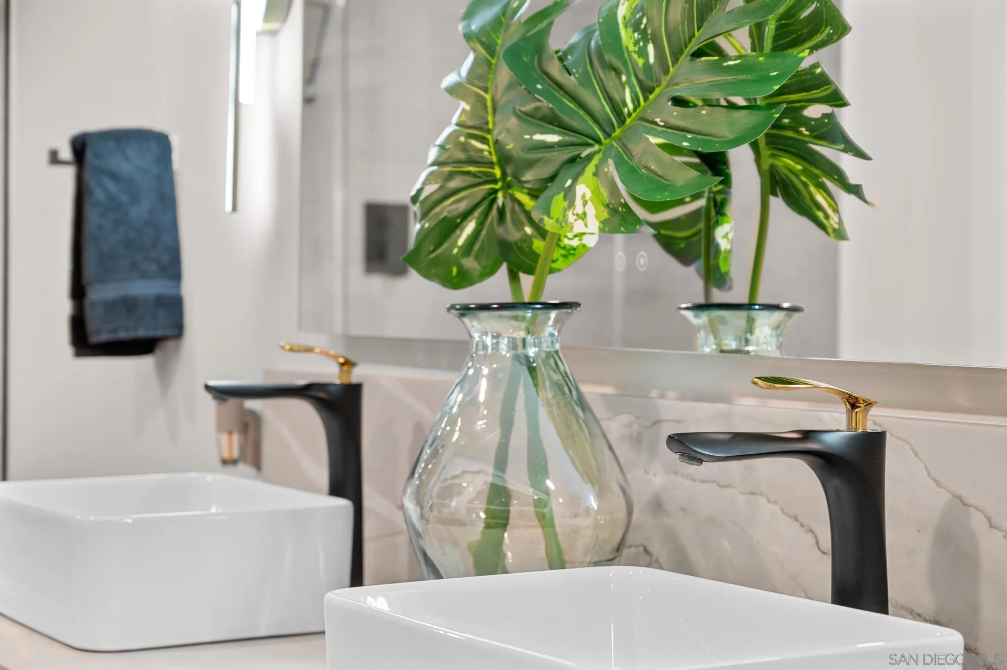 1735 Aldersgate Road Encinitas, CA 92024 - Photo 43 of 49 a bathroom with a sink and a mirror